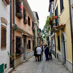 Taking a stroll after lunch in the Chianalea fishing village of Scilla Chianalea street